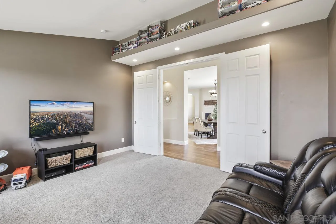 13192 Yerba Valley Way Lakeside, CA 92040 - Photo 22 of 58 a living room with furniture and a flat screen tv