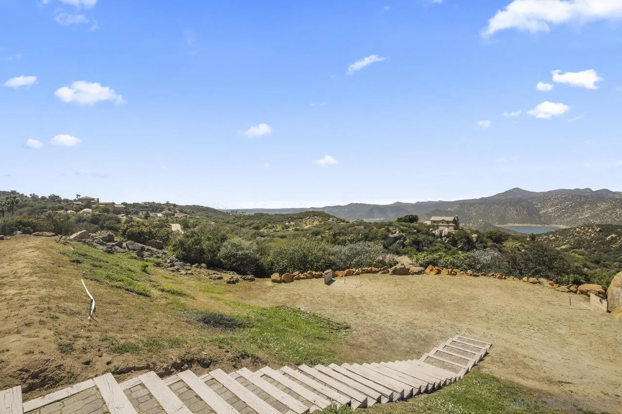 13192 Yerba Valley Way Lakeside, CA 92040 - Photo 30 of 58 a view of a lake with mountains in the background