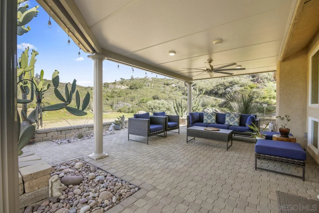 13192 Yerba Valley Way Lakeside, CA 92040 - Photo 46 of 58 a living room with furniture and a floor to ceiling window