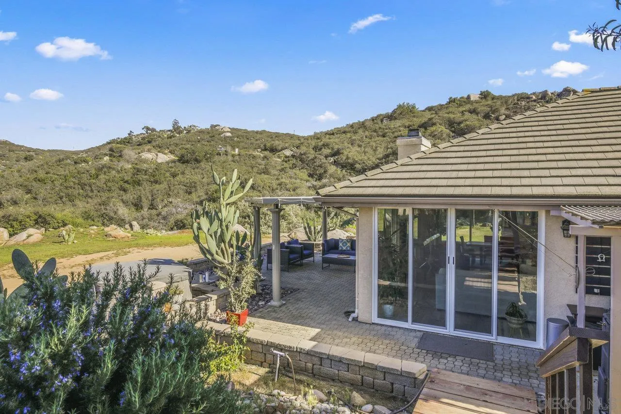 13192 Yerba Valley Way Lakeside, CA 92040 - Photo 50 of 58 a view of a large building with a mountain view