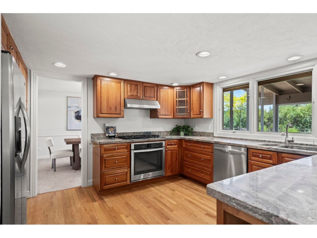 4398 Carter Trail Boulder, CO 80301 - Photo 10 of 41 Kitchen with Cherry Cabinetry, slab granite & stainless appliances