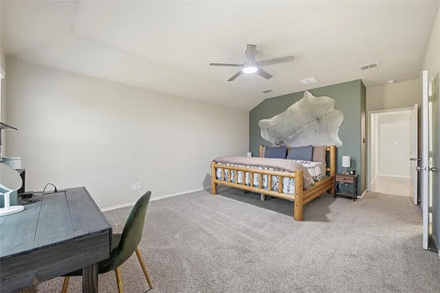 a bedroom with a bed and a table in it