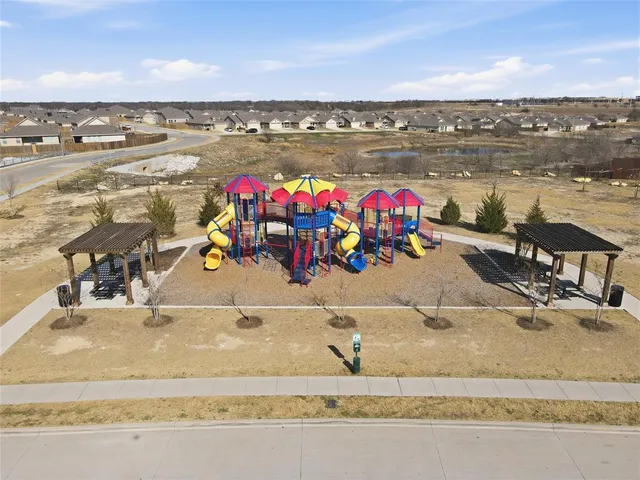 a view of a park with swings