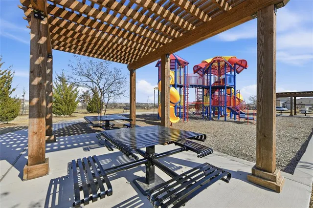 a view of a swimming pool with a table and chairs