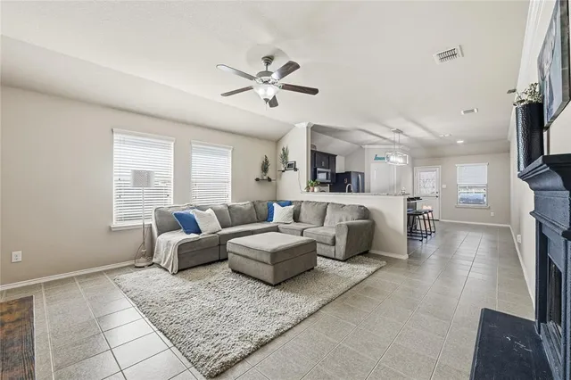 a living room with furniture and a large window