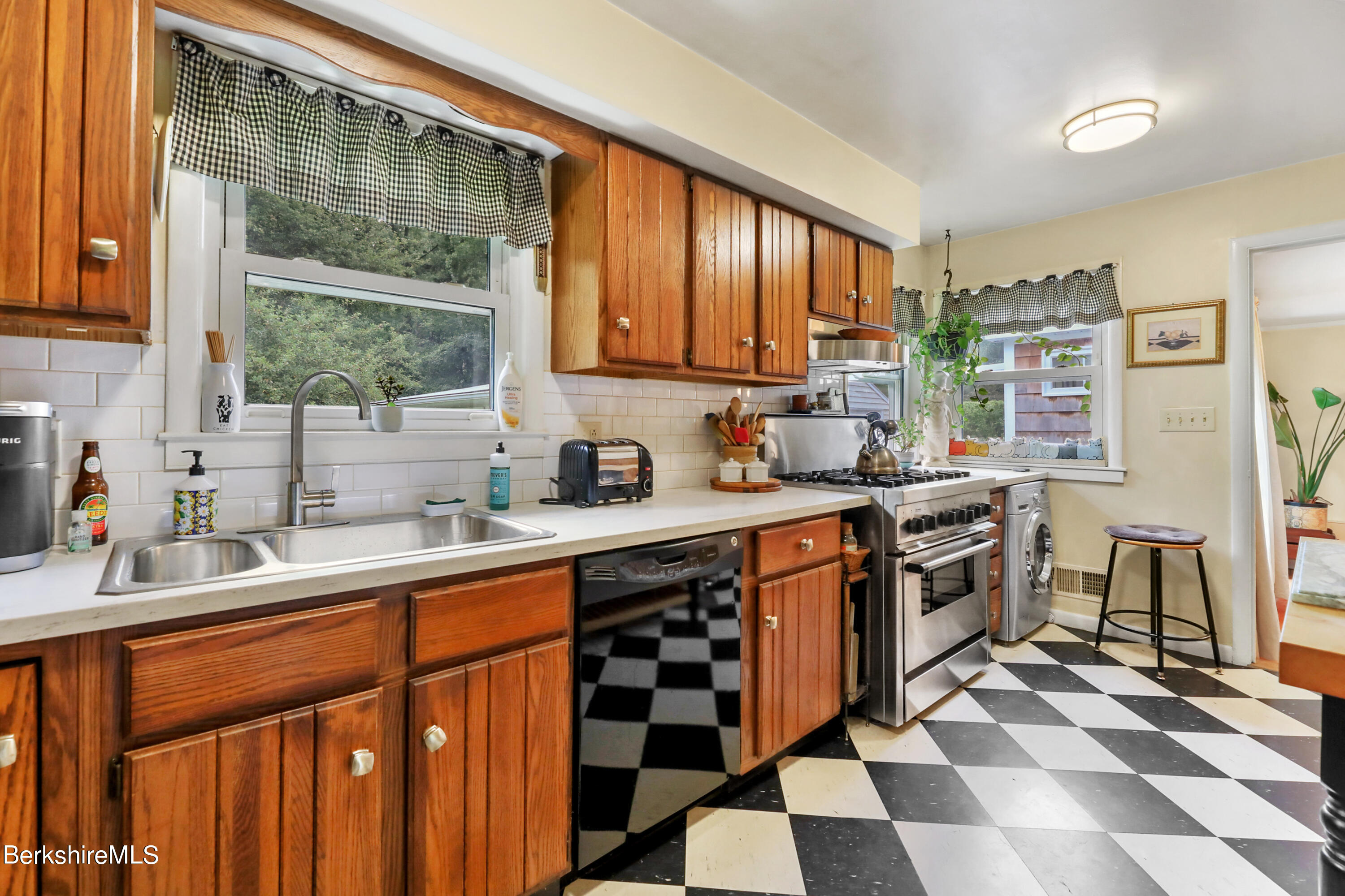 16 East New Lenox Road Lenox, MA 01240 - Photo 11 of 28 a kitchen with stainless steel appliances a sink stove and refrigerator