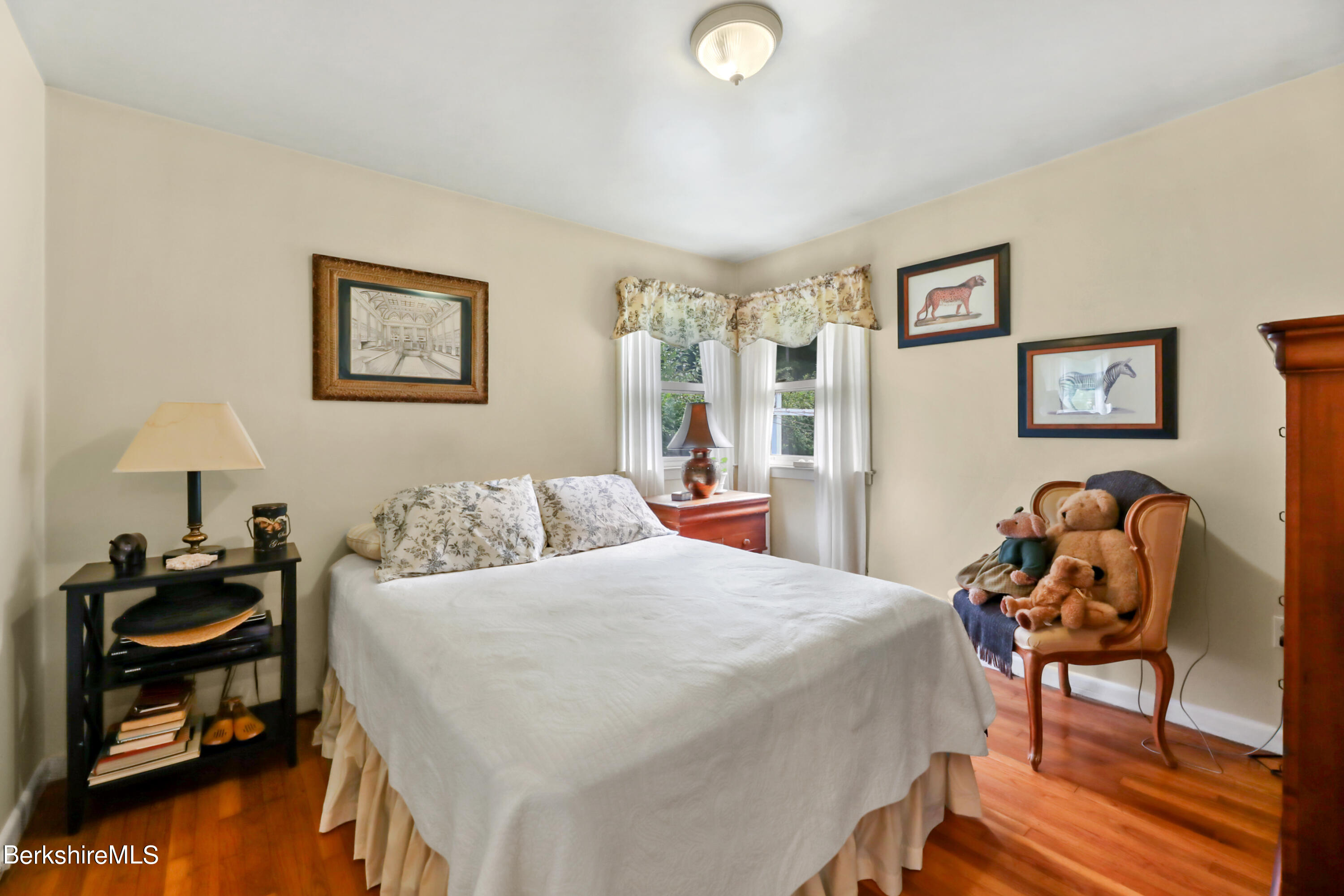 16 East New Lenox Road Lenox, MA 01240 - Photo 13 of 28 a bedroom with a bed and a lamp on table