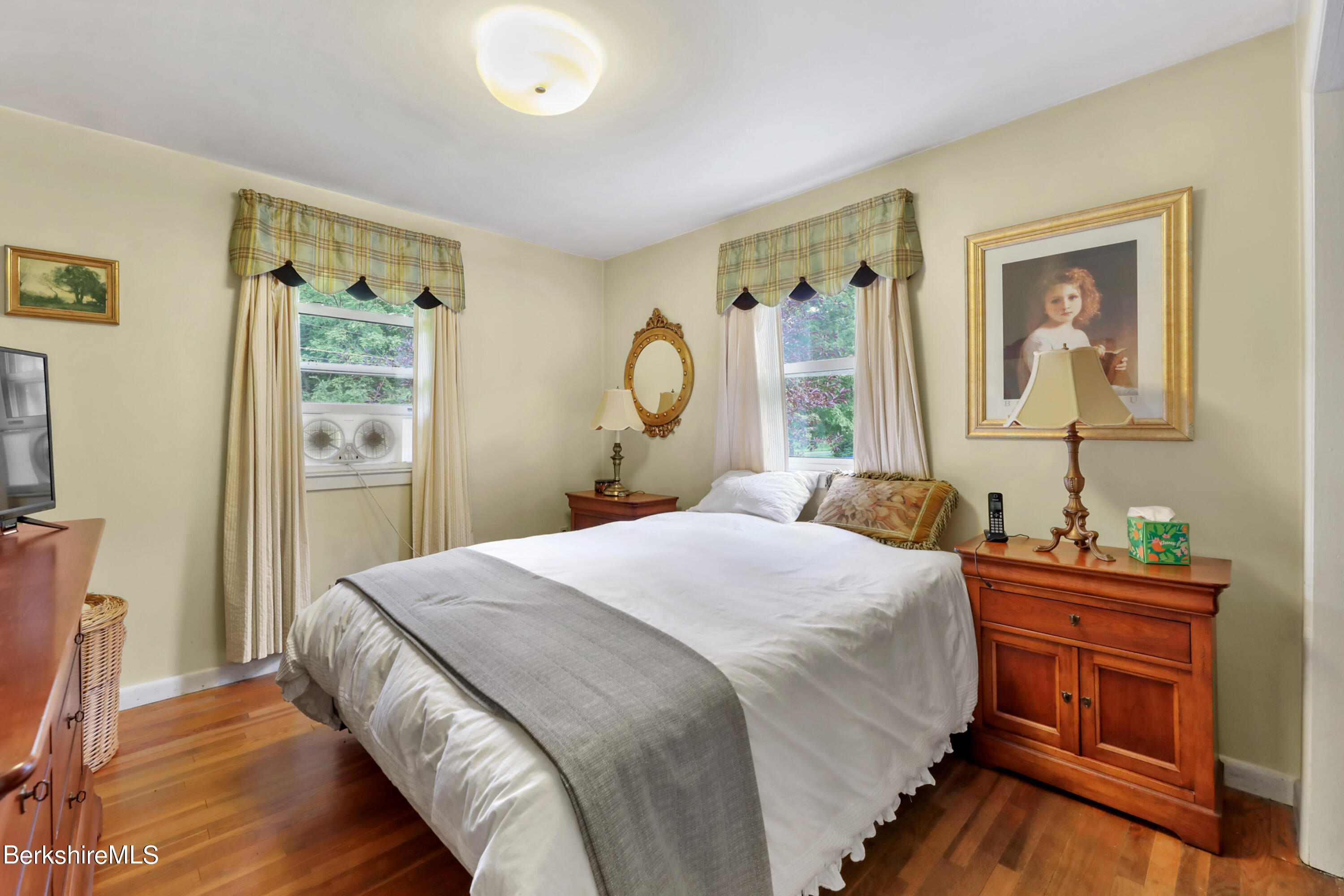 16 East New Lenox Road Lenox, MA 01240 - Photo 15 of 28 a bedroom with a bed and a table in it