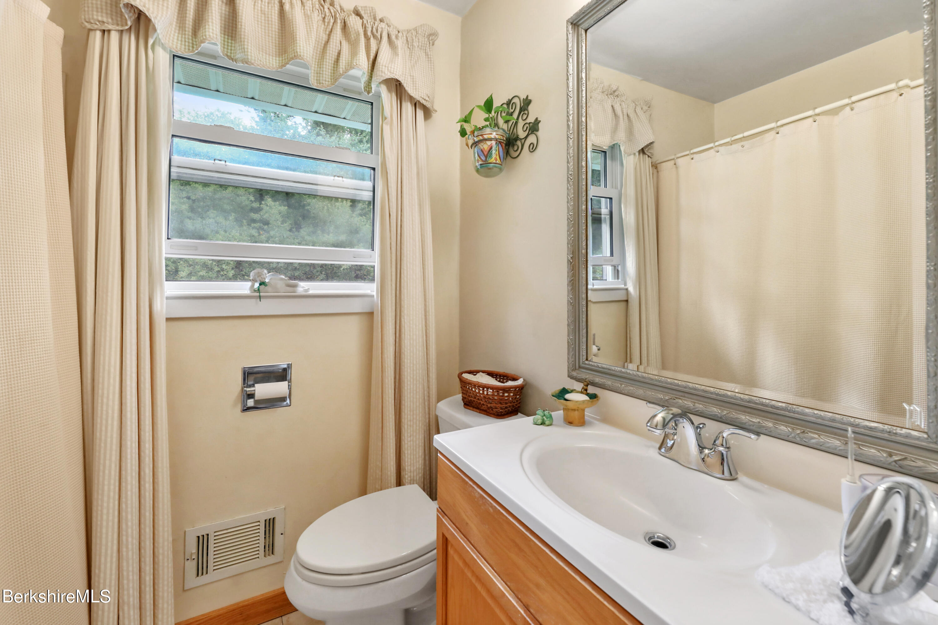 16 East New Lenox Road Lenox, MA 01240 - Photo 18 of 28 a bathroom with a sink a toilet a mirror and a shower