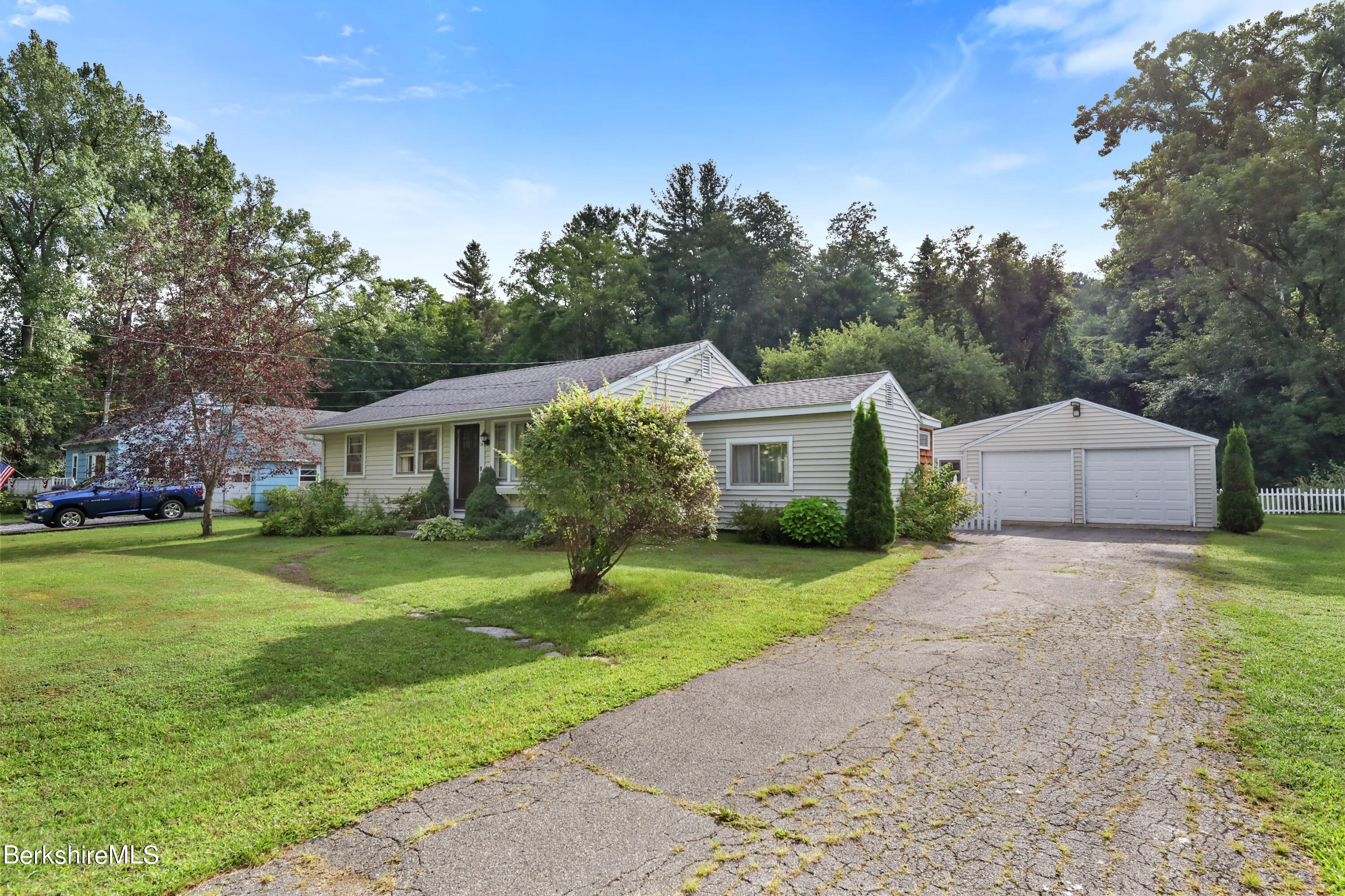 16 East New Lenox Road Lenox, MA 01240 - Photo 2 of 28 a front view of house with yard and trees in the background