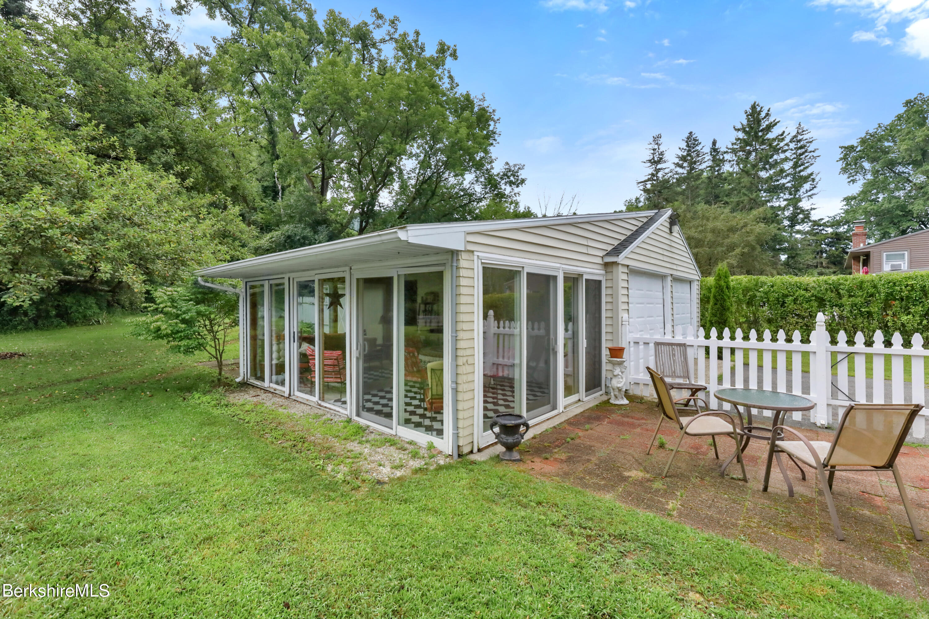 16 East New Lenox Road Lenox, MA 01240 - Photo 24 of 28 a view of a house with a yard and a garden