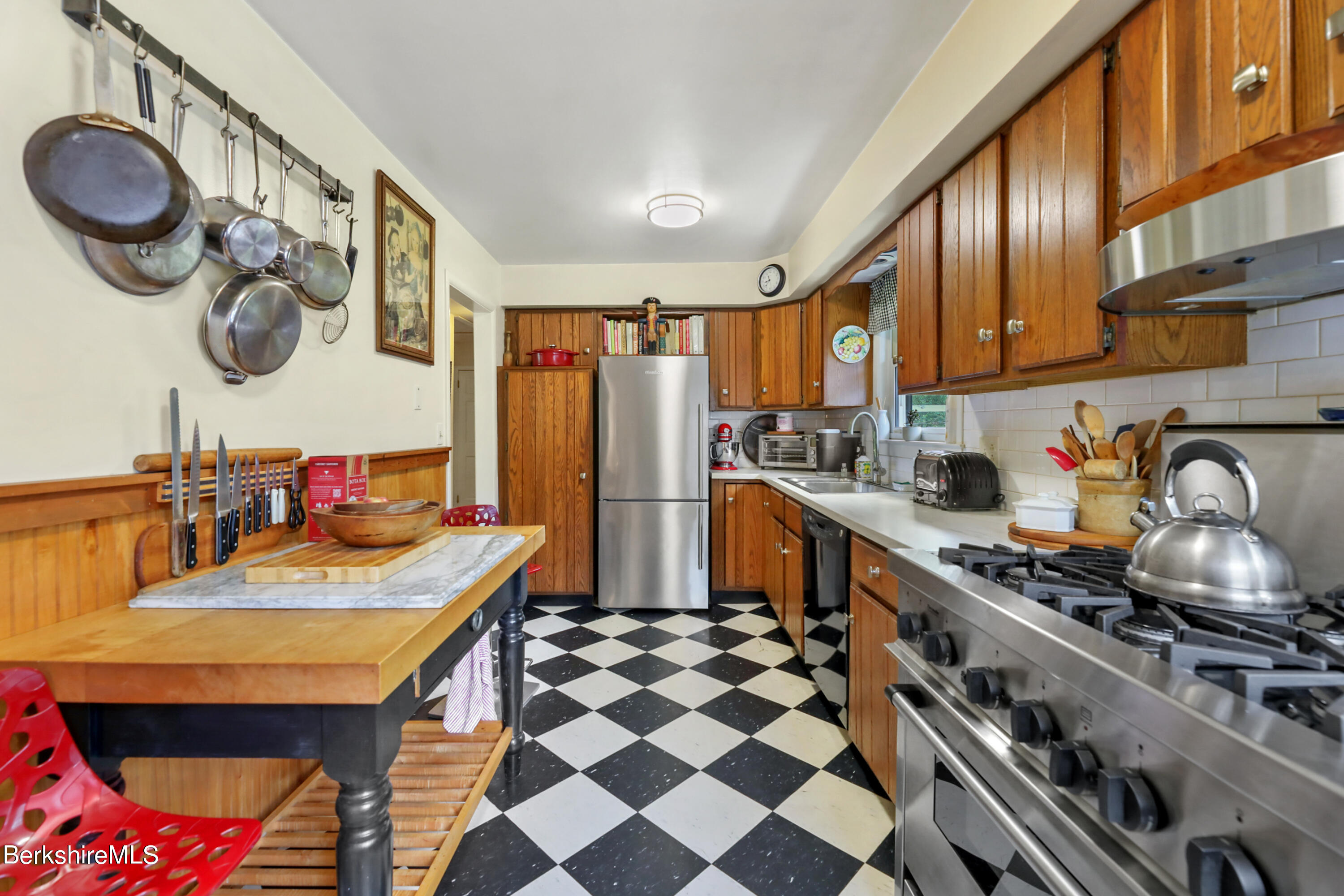 16 East New Lenox Road Lenox, MA 01240 - Photo 9 of 28 a kitchen with stainless steel appliances granite countertop a stove a sink and a refrigerator