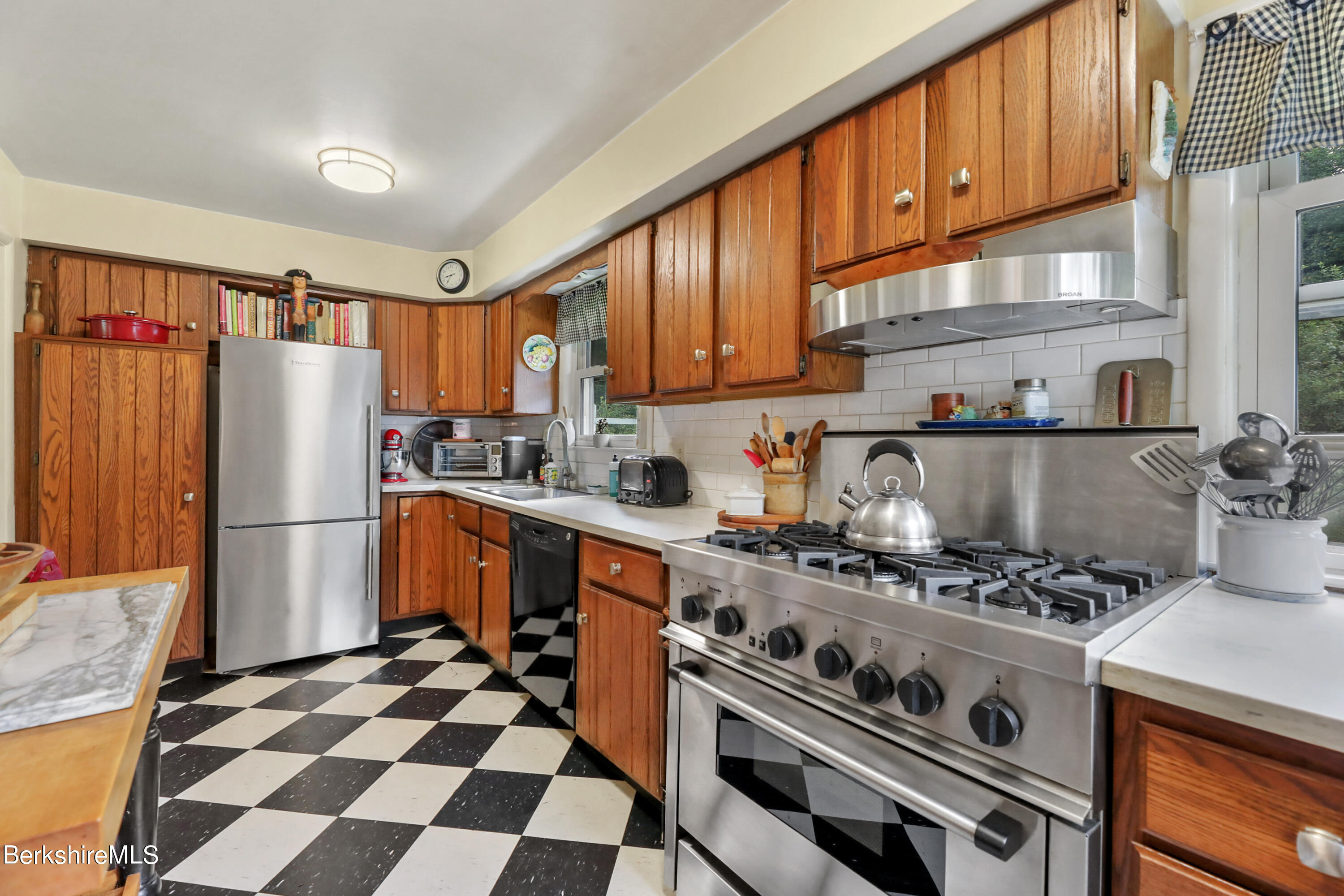 16 East New Lenox Road Lenox, MA 01240 - Photo 10 of 28 a kitchen with stainless steel appliances a refrigerator a sink and a stove