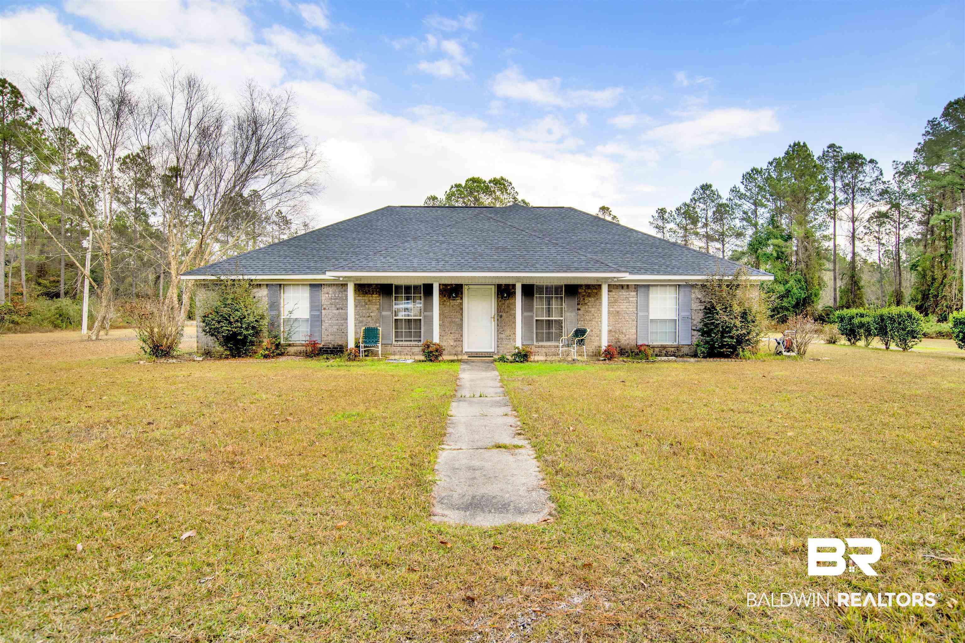 36434 Alexandria Trail Stapleton, AL 36578 - Photo 1 of 27 Ranch-style home with covered porch, a front yard, brick siding, and roof with shingles