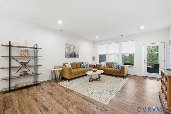 a bedroom with a large bed and a tv