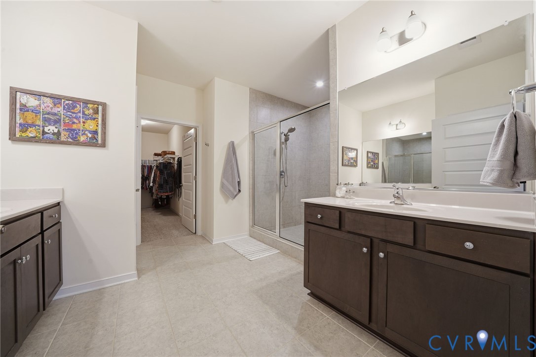 9204 Cerulean Place Richmond, VA 23238 - Photo 30 of 62 a bathroom with a double vanity sink mirror and double