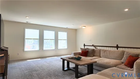 an aerial view of a house with a lake view