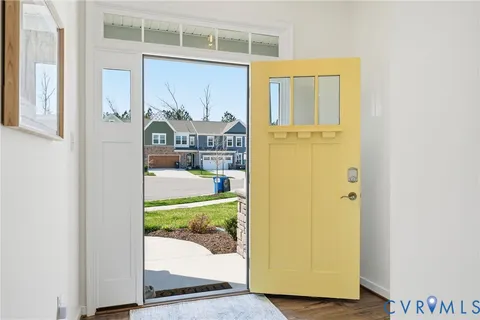 a bathroom with a sink a toilet a mirror and shower