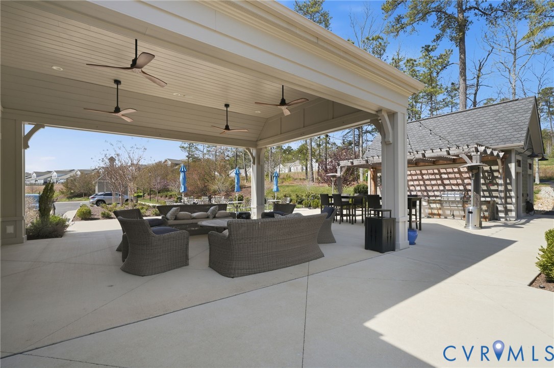9204 Cerulean Place Richmond, VA 23238 - Photo 55 of 62 a view of a patio with a dining table and chairs