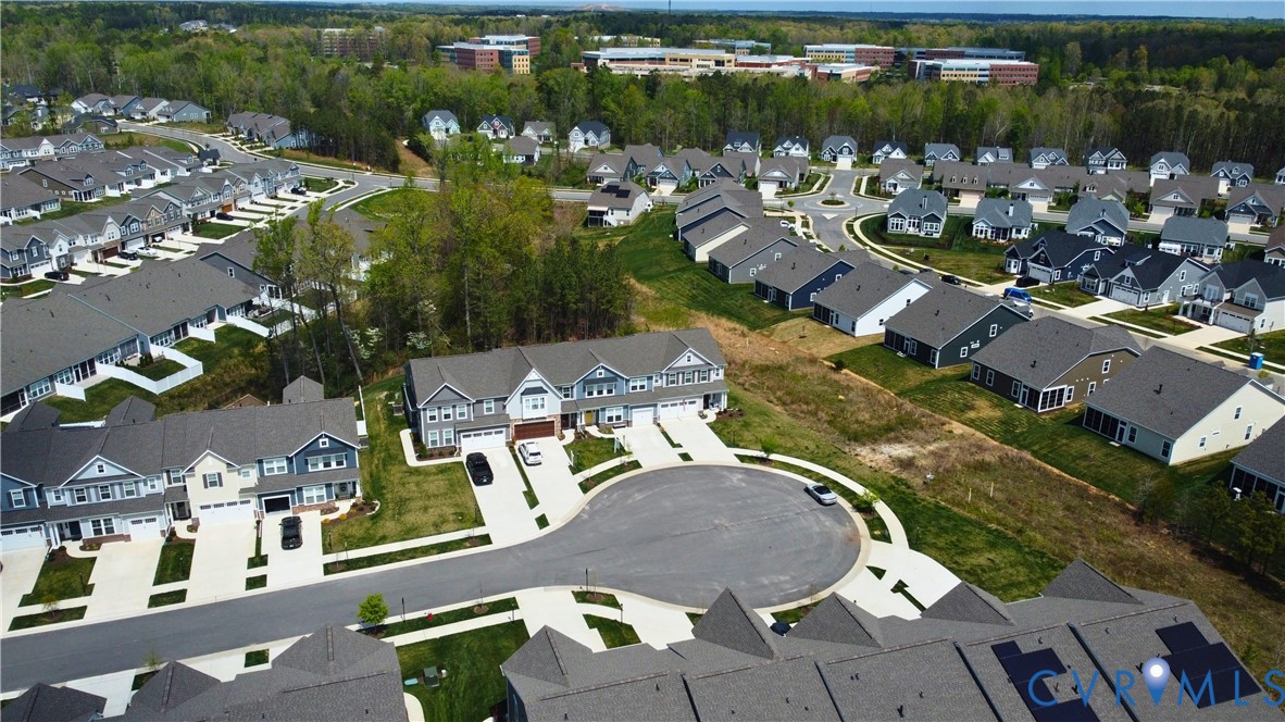 9204 Cerulean Place Richmond, VA 23238 - Photo 61 of 62 an aerial view of a house with a lake view