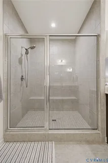 a kitchen with stainless steel appliances a sink dishwasher a refrigerator a stove top oven a refrigerator and cabinets with wooden floor