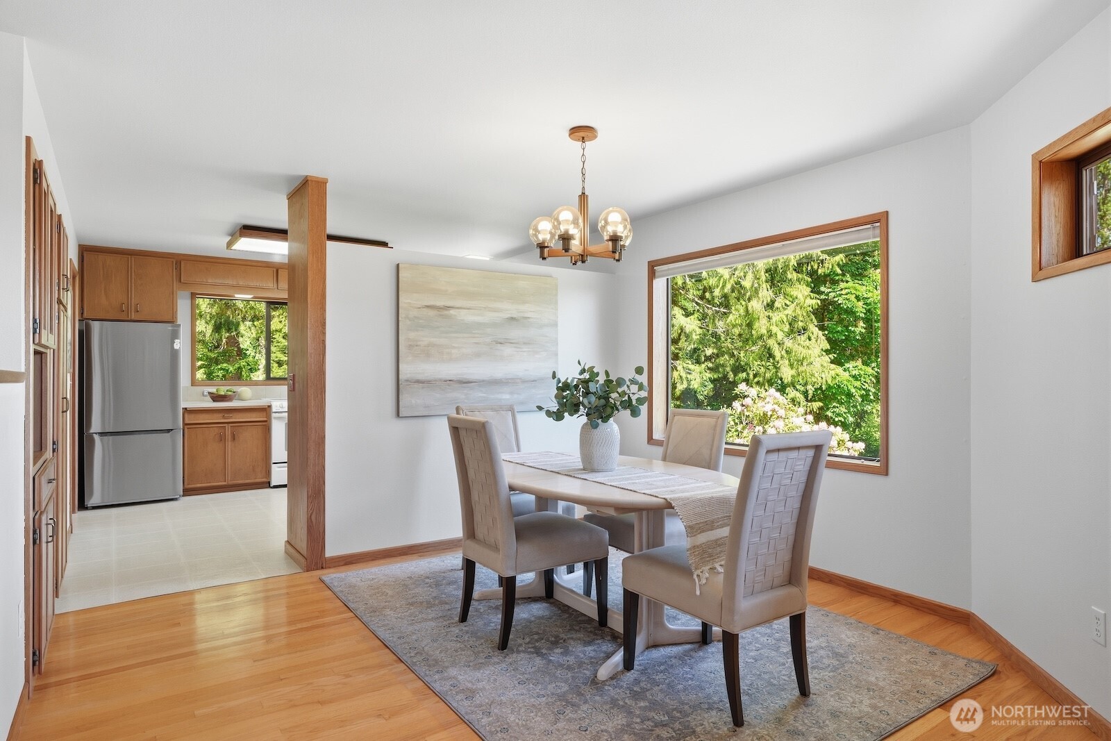 30130 Southeast Issaquah-Fall City Road Fall City, WA 98024 - Photo 11 of 39 a dining room with furniture a chandelier and wooden floor