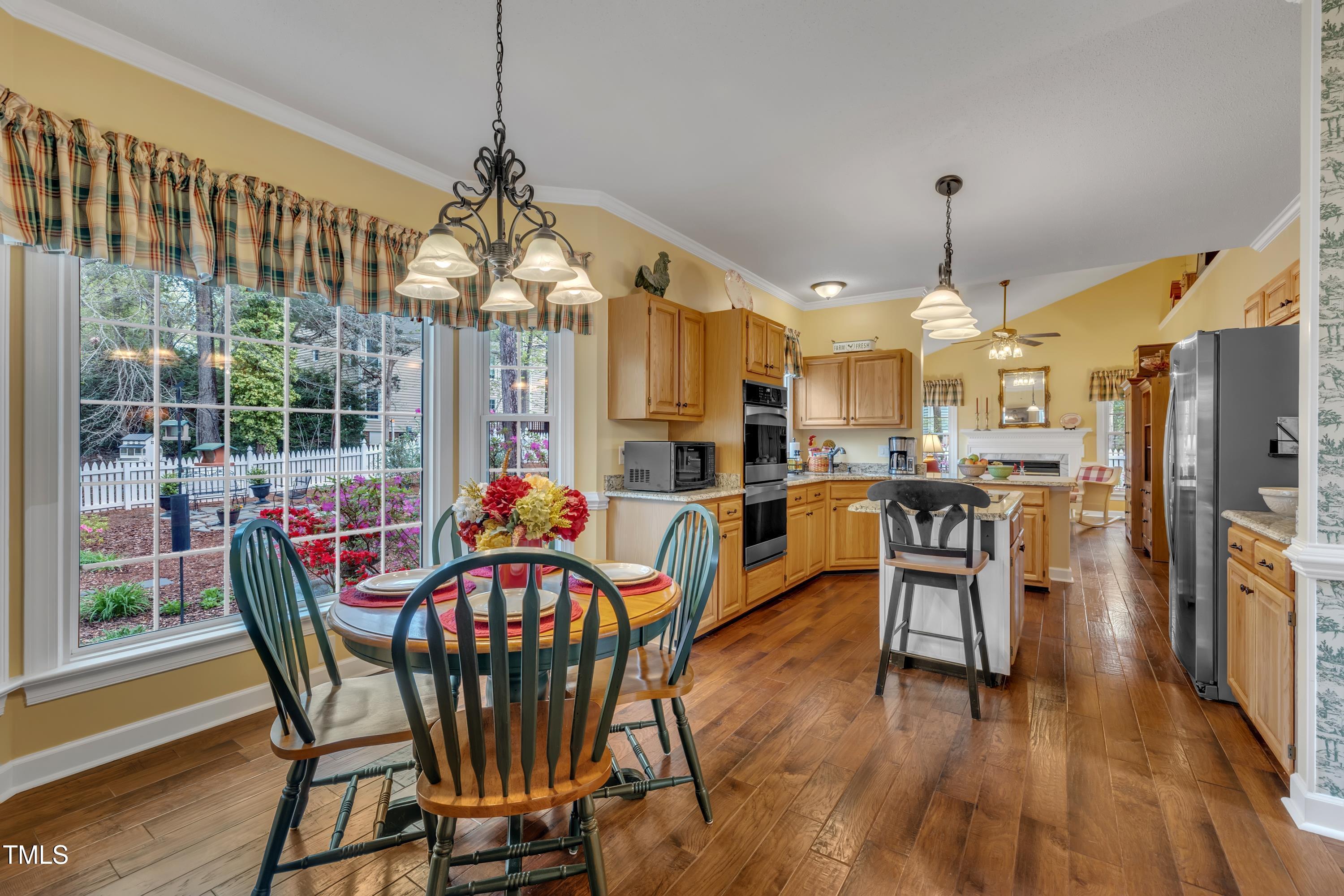 1100 Queensbury Circle Durham, NC 27713 - Photo 12 of 35 a view of a dining room with furniture window and wooden floor