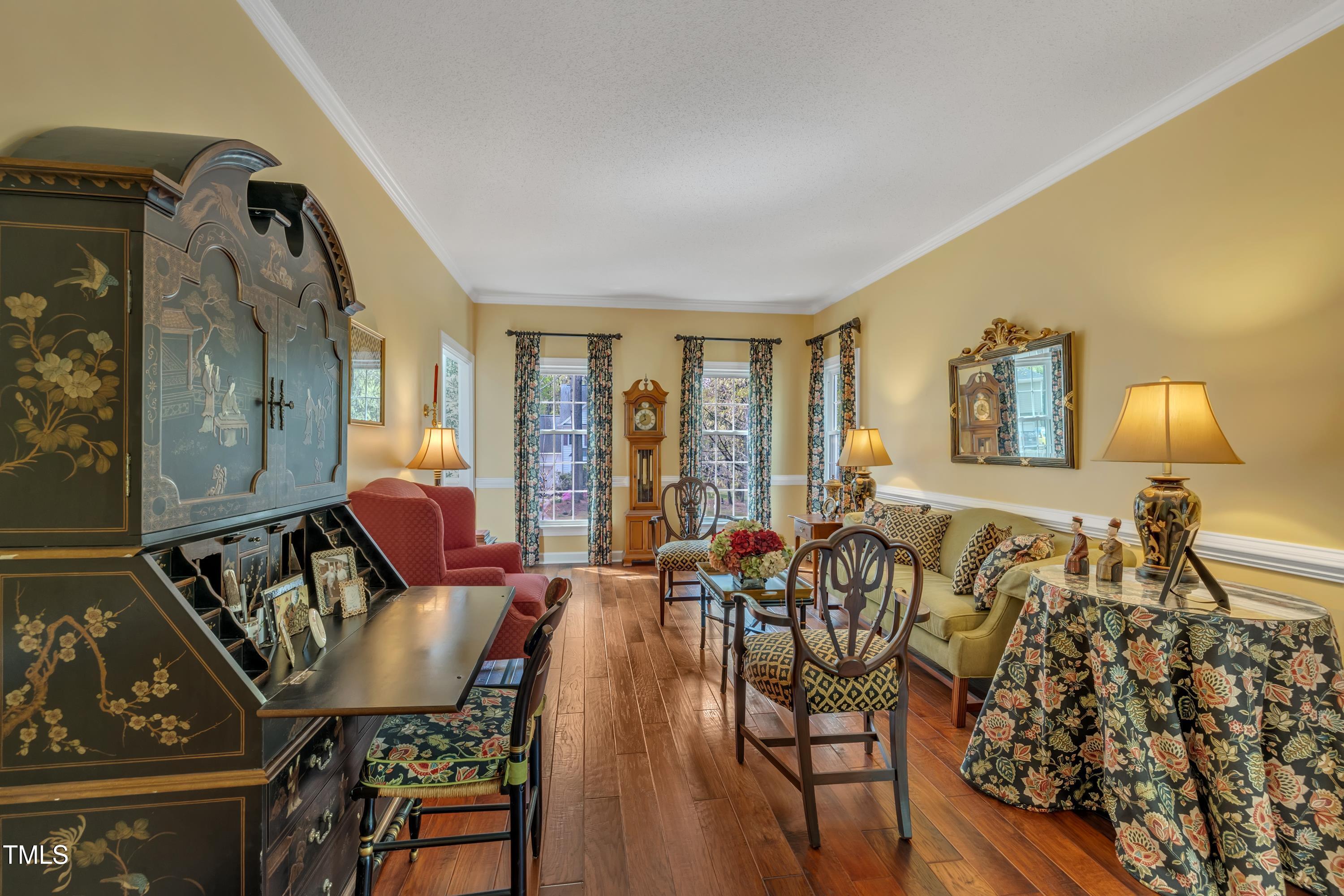 1100 Queensbury Circle Durham, NC 27713 - Photo 16 of 35 a living room with furniture and wooden floor