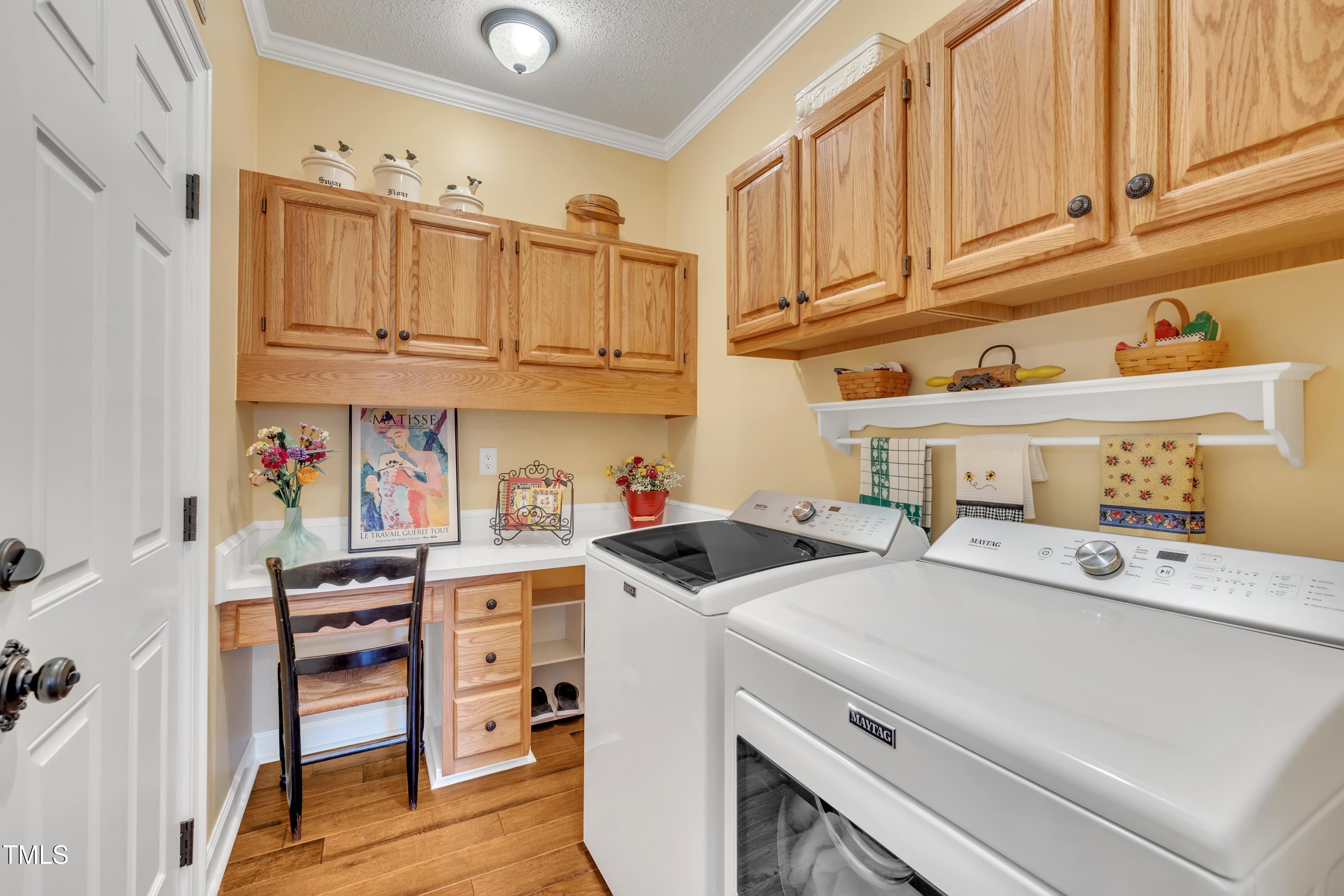 1100 Queensbury Circle Durham, NC 27713 - Photo 29 of 35 a view of kitchen with cabinets and wooden floor