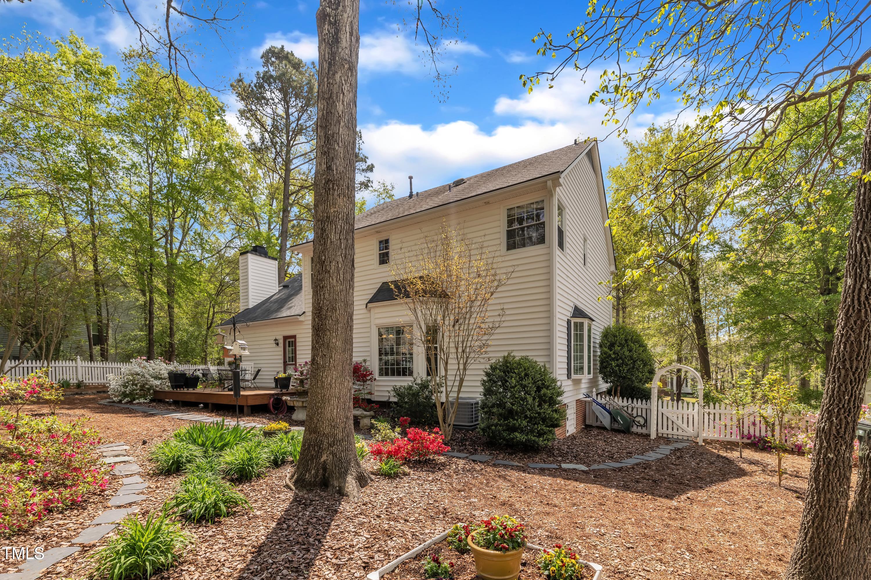 1100 Queensbury Circle Durham, NC 27713 - Photo 30 of 35 a view of a street with potted plants and large tree