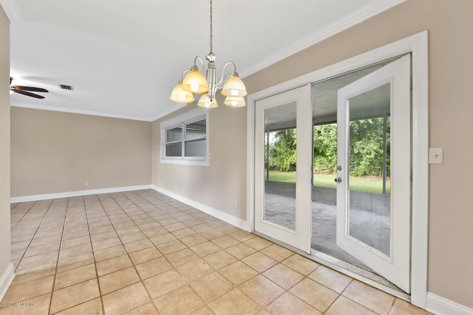 11152 Emuness Road Jacksonville, FL 32218 - Photo 8 of 20 Dining Area into screened porch