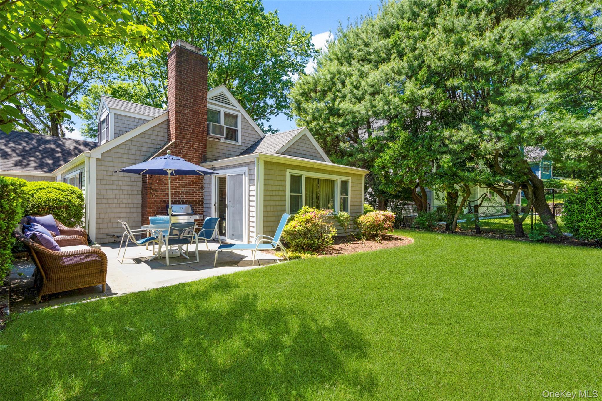 1 Highridge Road Larchmont, NY 10538 - Photo 25 of 33 Patio with lush lawn