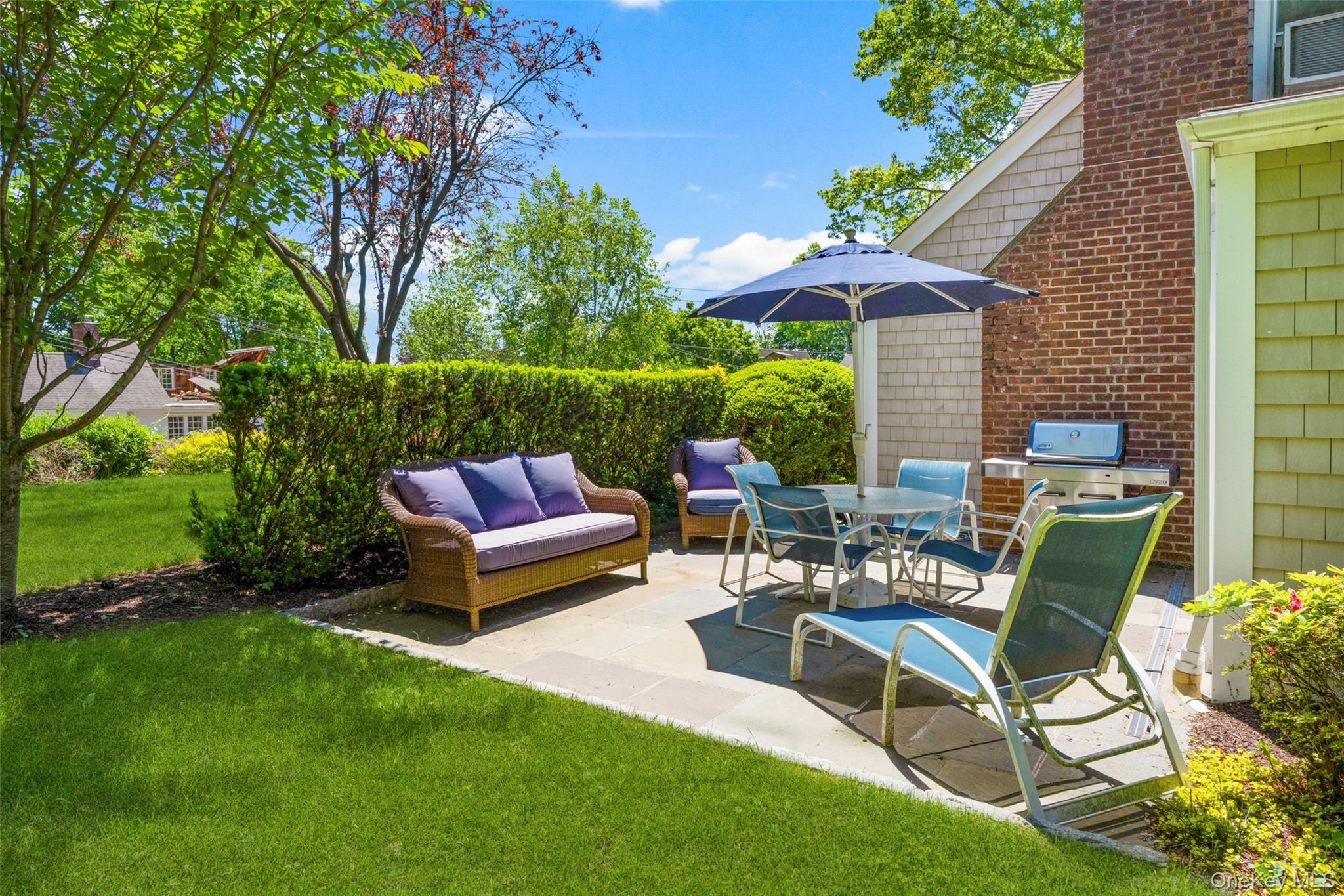 1 Highridge Road Larchmont, NY 10538 - Photo 26 of 33 Patio hedges facing front lawn