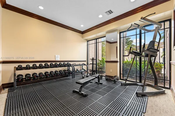 a porch with a table and chairs