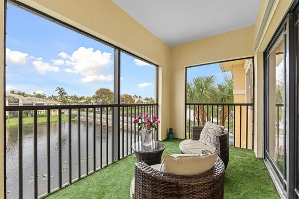 a balcony with furniture and a garden