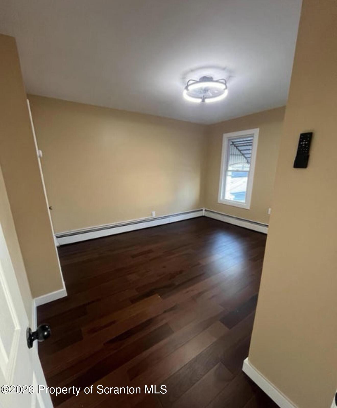 129 South Blakely Street, Unit 2 Dunmore, PA 18512 - Photo 8 of 8 a view of livingroom with hardwood floor and window