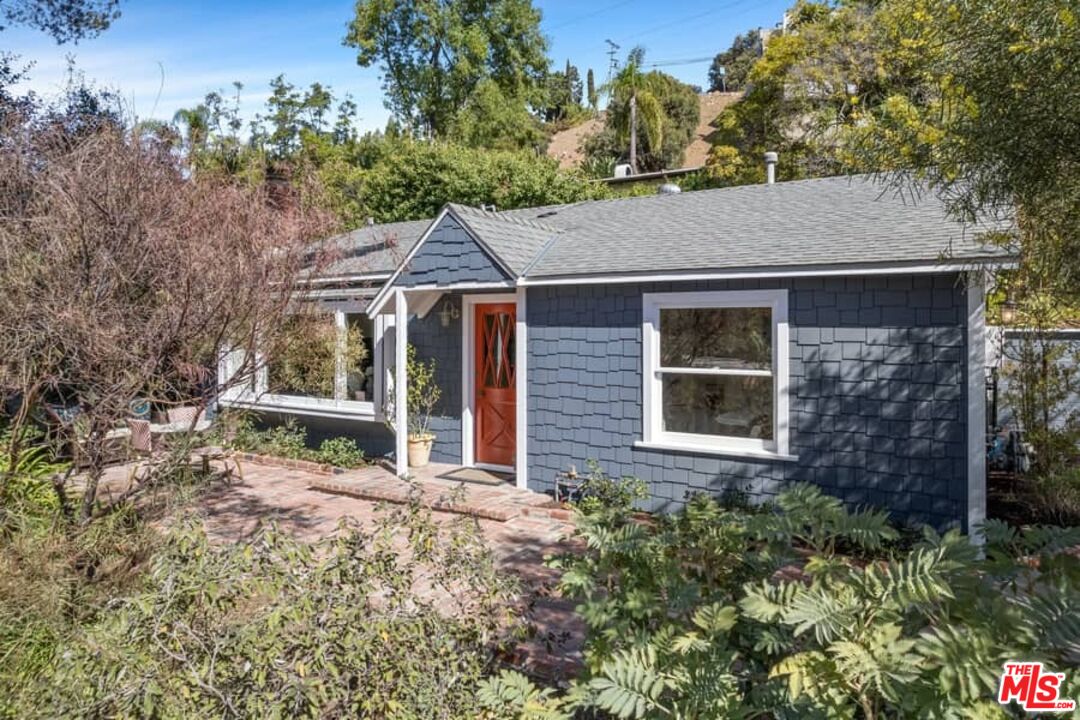 a house view with a garden space