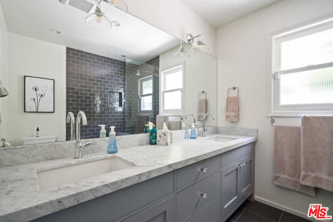 2850 Nichols Canyon Road Los Angeles, CA 90046 - Photo 19 of 38 a bathroom with double vanity sinks double vanity and a mirror