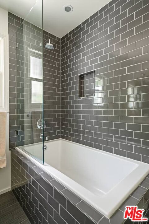 2850 Nichols Canyon Road Los Angeles, CA 90046 - Photo 20 of 38 a bathroom with a bathtub and shower