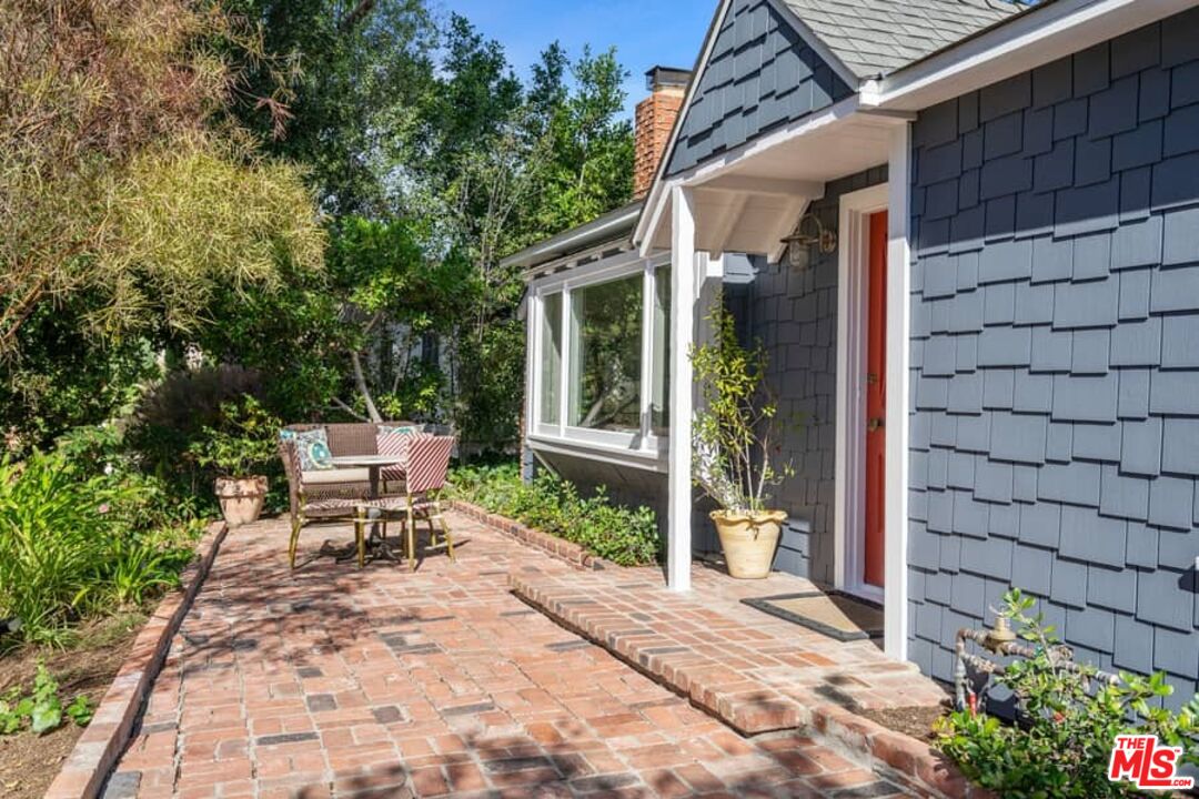 2850 Nichols Canyon Road Los Angeles, CA 90046 - Photo 2 of 38 a view of a chair and fire pit in the patio with a small yard