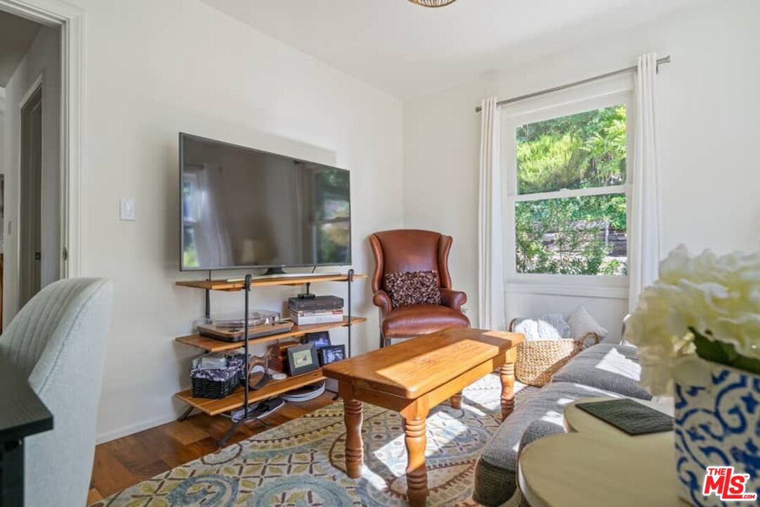 2850 Nichols Canyon Road Los Angeles, CA 90046 - Photo 22 of 38 a living room with furniture a window and a flat screen tv