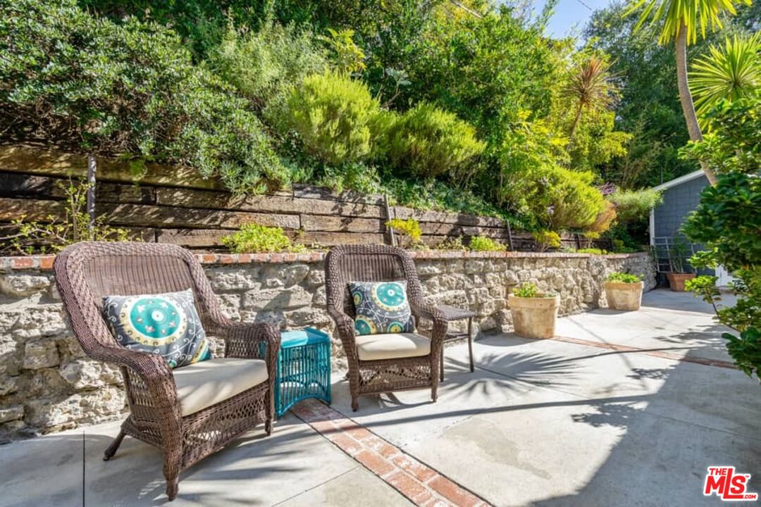 2850 Nichols Canyon Road Los Angeles, CA 90046 - Photo 24 of 38 a view of a patio with couches table and chairs and potted plants