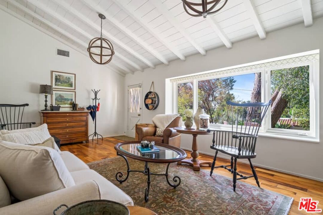 2850 Nichols Canyon Road Los Angeles, CA 90046 - Photo 8 of 38 a living room with furniture a window and a table