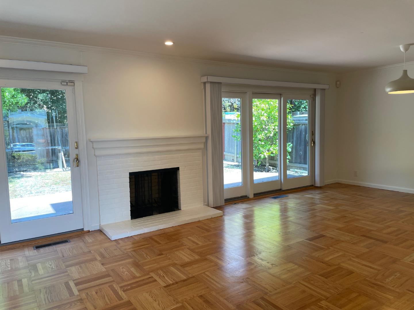 1320 Ridgewood Drive Millbrae, CA 94030 - Photo 2 of 18 a view of a livingroom with a fireplace and window