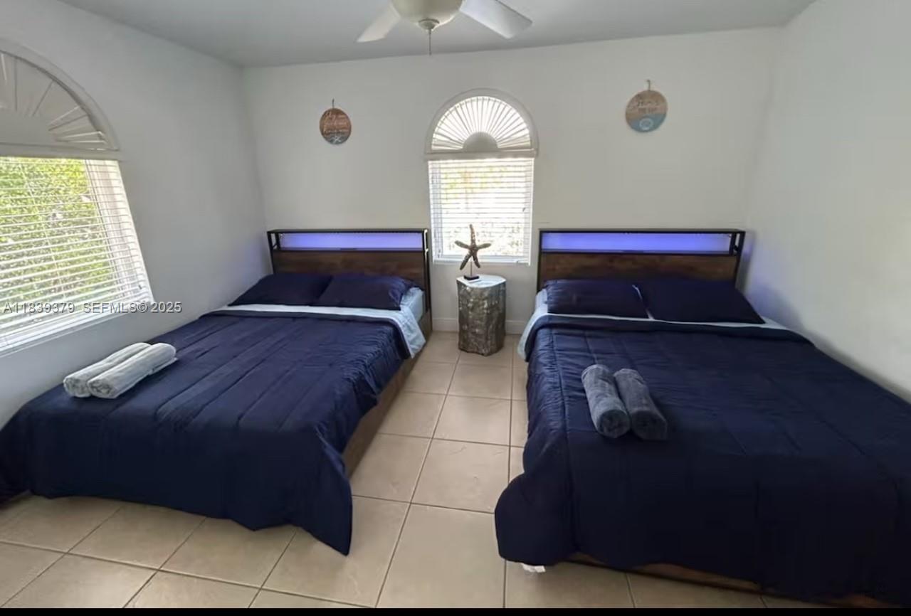 350 Hazel Street, Unit 350 Key Largo, FL 33037 - Photo 7 of 11 a bedroom with bed and window
