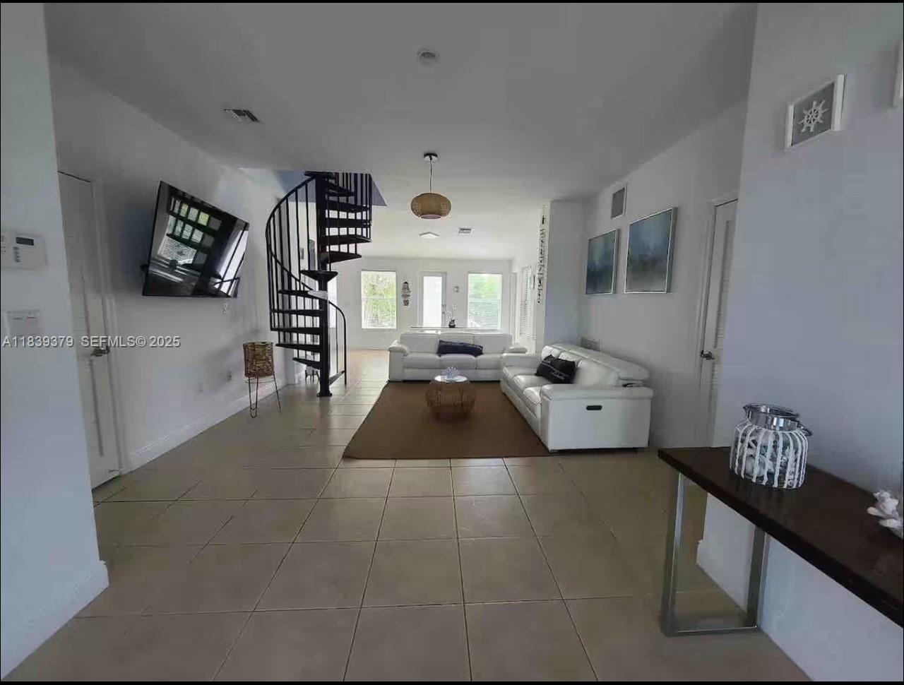 350 Hazel Street, Unit 350 Key Largo, FL 33037 - Photo 8 of 11 a living room with furniture and a large window