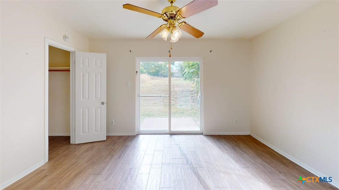 802 Hackberry Street, Unit A Copperas Cove, TX 76522 - Photo 4 of 11 a view of a room with wooden floor fan and a window
