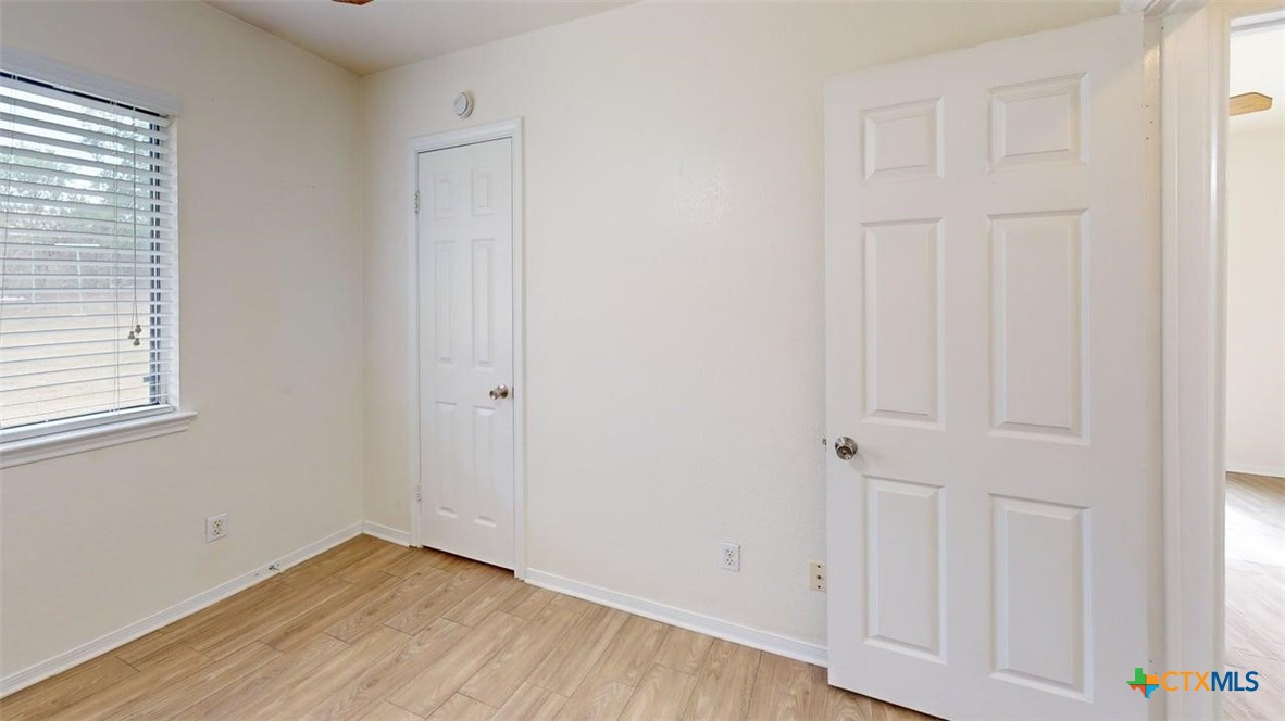 802 Hackberry Street, Unit A Copperas Cove, TX 76522 - Photo 7 of 11 a view of an empty room with closet and a window