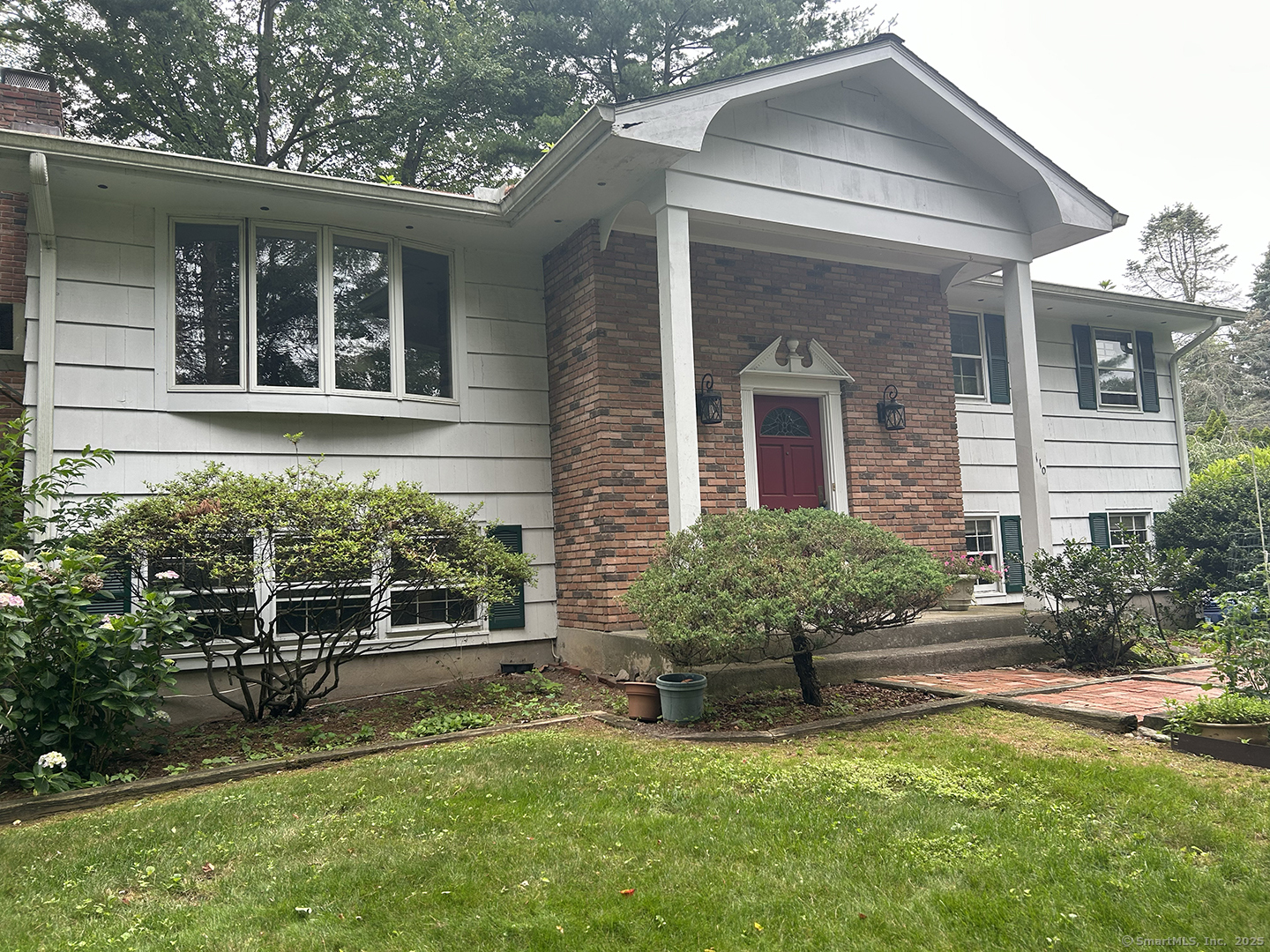 front view of a house with a yard