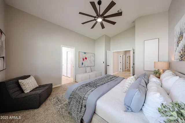 a bedroom with a bed and a couch